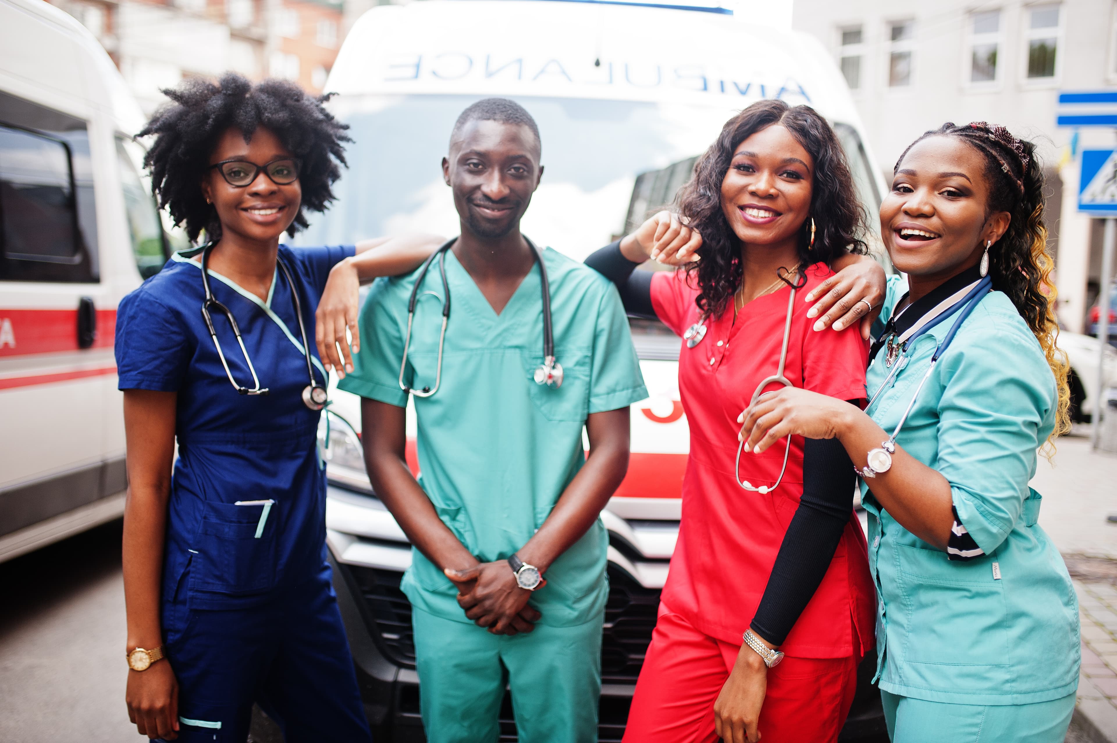 Group of nurses smiling together outdoors